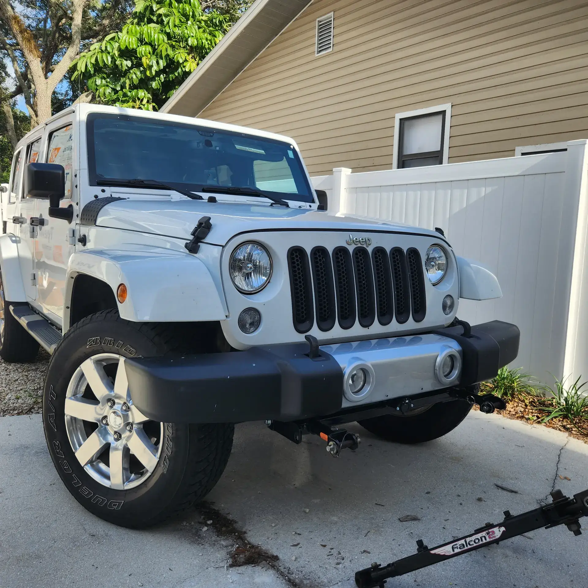 Jeep Wrangler with a newly installed tow bar base plate in Bradenton, Florida