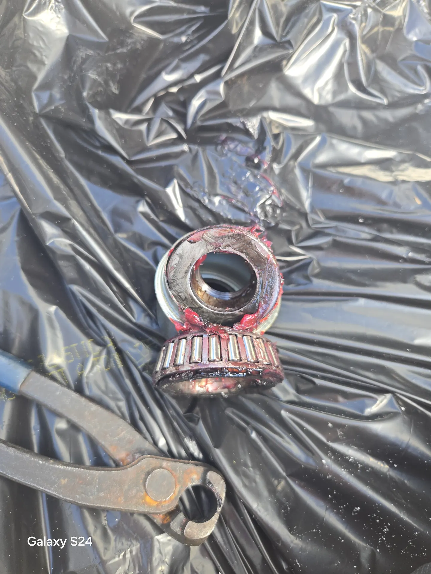 Freshly packed trailer wheel bearing during an RV bearing service in Venice, Florida