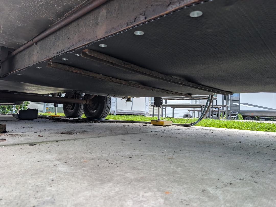 Underbelly view of an RV during mobile repair by Rudy's RV Repair in Sarasota, Florida