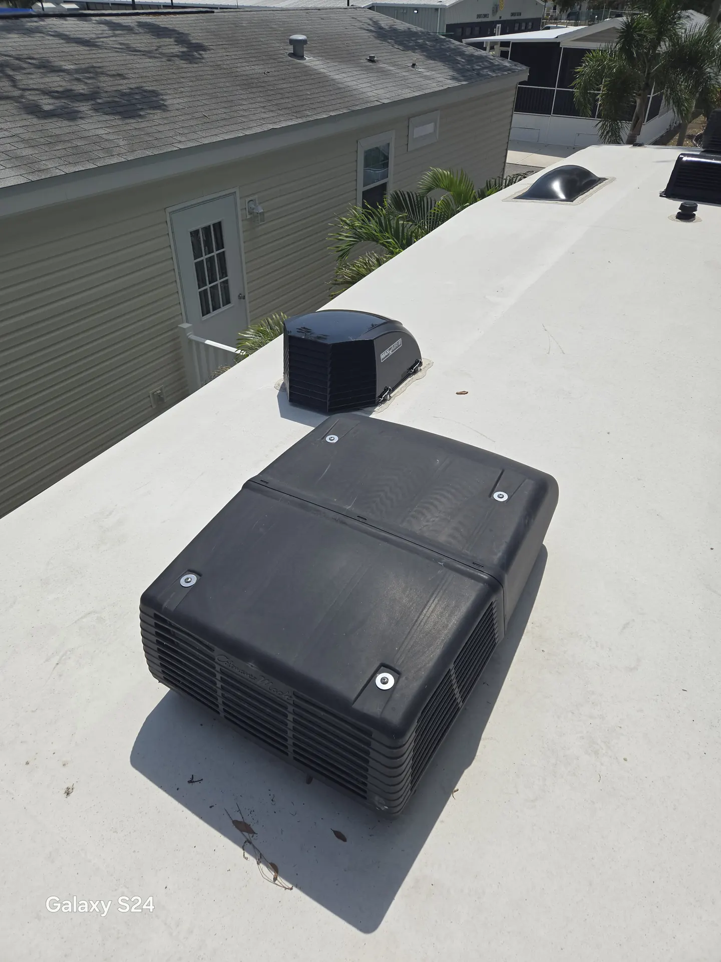 Rooftop air conditioner serviced on an RV roof near Siesta Key, Florida