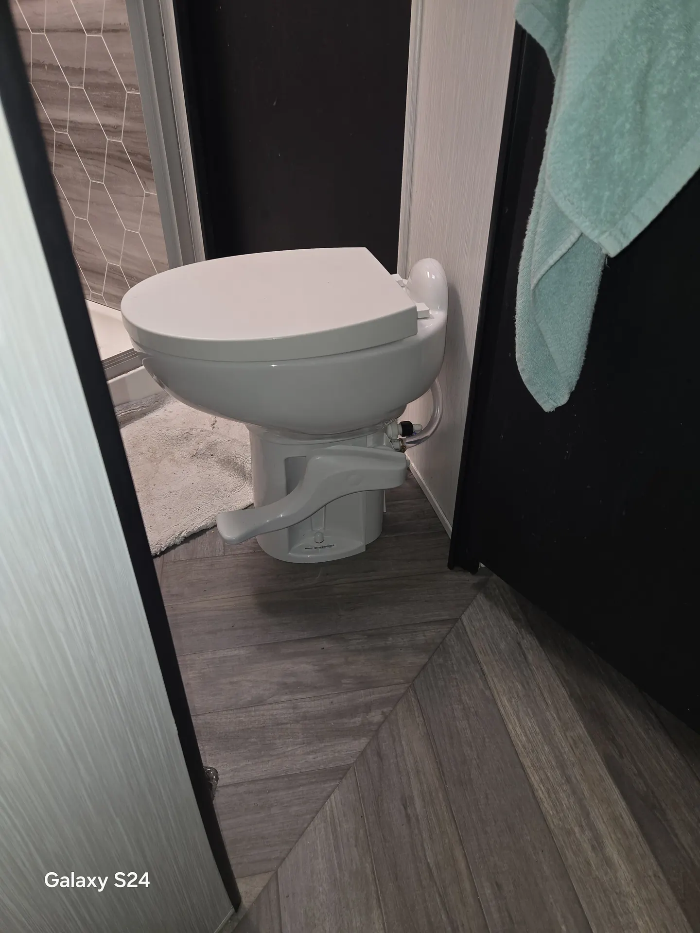 Newly installed RV toilet in a camper bathroom on Anna Maria Island, FL