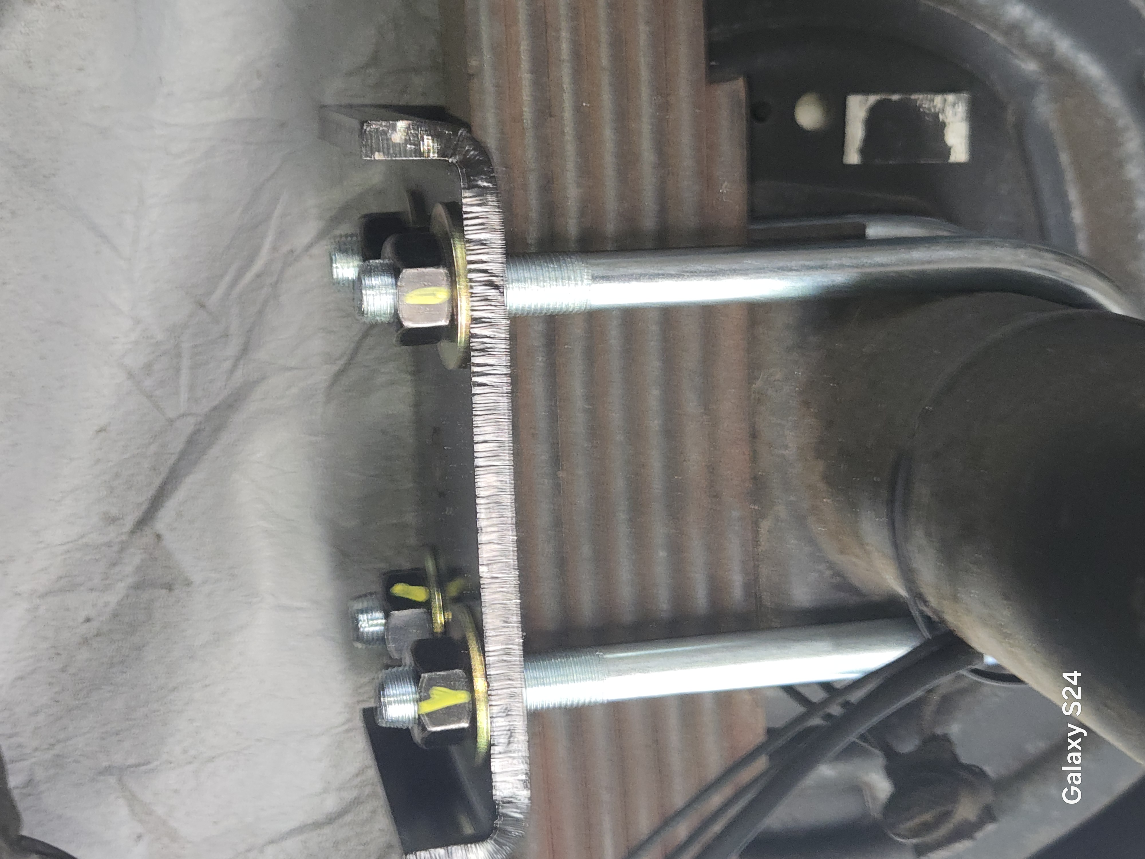 RV undercarriage bolts and hardware secured during repair by Rudy's RV Repair in Sarasota, Florida