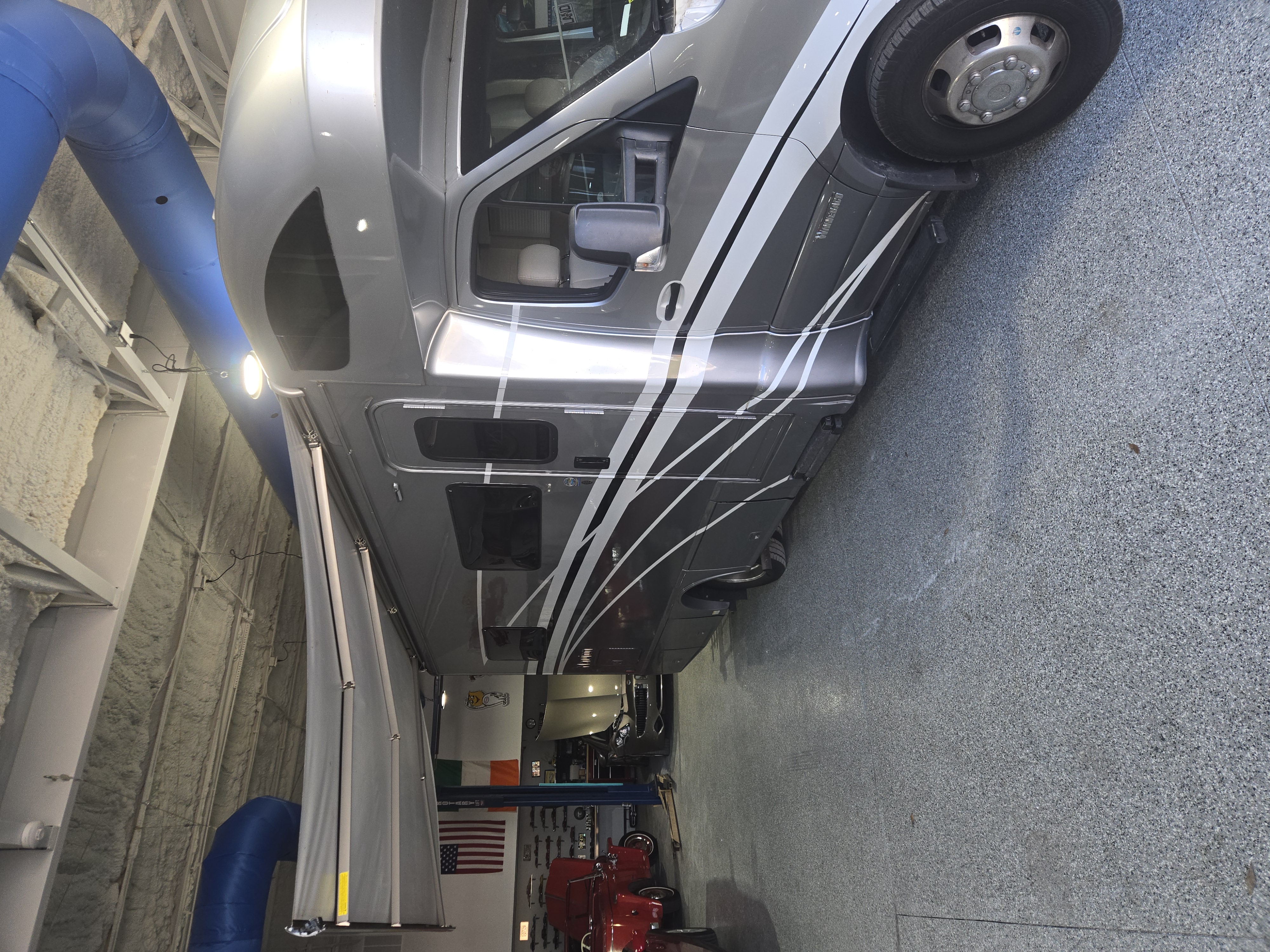 Motorhome raised in an RV service bay for inspection and repair